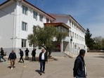 Police officers guard the school where a shooting took place i southern Turkey