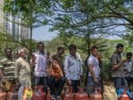 iMumbai, India - March 13, 2026: Residents queue up with empty cylinders for LPG cooking gas refills at Charkop in Kandivali, Mumbai, amid supply concerns triggered by the ongoing Iran–US conflict in Mumbai, India, on Friday, March 13, 2025. (Photo by Satish Bate/ Hindustan Times) (Hindustan Times)