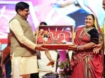 Chief Minister Mohan Yadav honours Class 10 and 12 toppers during the Nari Shakti Vandan Sammelan in Bhopal.
