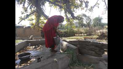 An elderly woman draws water from a well in Khinariya village of Mahoba district, where a pipeline has been laid under the Har Ghar Jal scheme but water supply has yet to begin (HT Photo) An elderly woman draws water from a well in Khinariya village of Mahoba district, where a pipeline has been laid under the Har Ghar Jal scheme but water supply has yet to begin (HT Photo)