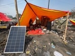 A solar panel, donated by a Good Samaritan, used for operating a fan in a tent. (HT Photo)