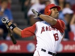 Former Los Angeles Angels' Garret Anderson watches the ball after hitting a two-run homer against the Toronto Blue Jays 