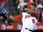 Los Angeles Angels' Garret Anderson watches the ball after hitting a two-run homer against the Toronto Blue Jays in the seventh inning of a baseball game in Anaheim, California.