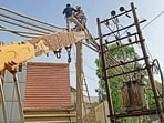 PSPCL workers repair power lines in Ludhiana on Friday. (HT Photo) PSPCL workers repair power lines in Ludhiana on Friday. (HT Photo)