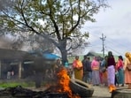 Bishnupur: People set fire to tyres as they block a road in protest after two children were killed and their mother was injured in a bomb attack, in Bishnupur district, Manipur, Tuesday, April 7, 2026. (PTI Photo) (PTI04_07_2026_000062A)