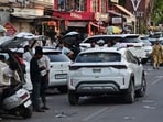 Vehicles parked on roadside outside commercial buildings in Civil Lines area. (Anil Kumar Maurya/HT)