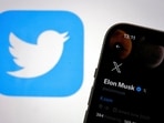 Twitter and X logos are seen amid reports of an outage.