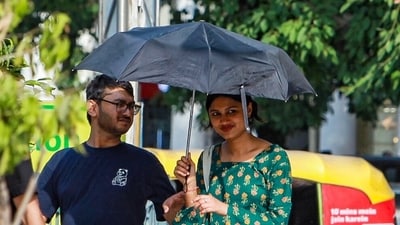 People cover themselves to escape the intense heat at Connaught Place, in New Delhi on Thursday. (ANI) People cover themselves to escape the intense heat at Connaught Place, in New Delhi on Thursday. (ANI)