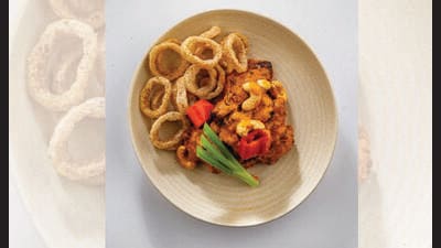 Butter chicken with onion rings at Nisaba, Delhi’s hottest new restaurant. Butter chicken with onion rings at Nisaba, Delhi’s hottest new restaurant.
