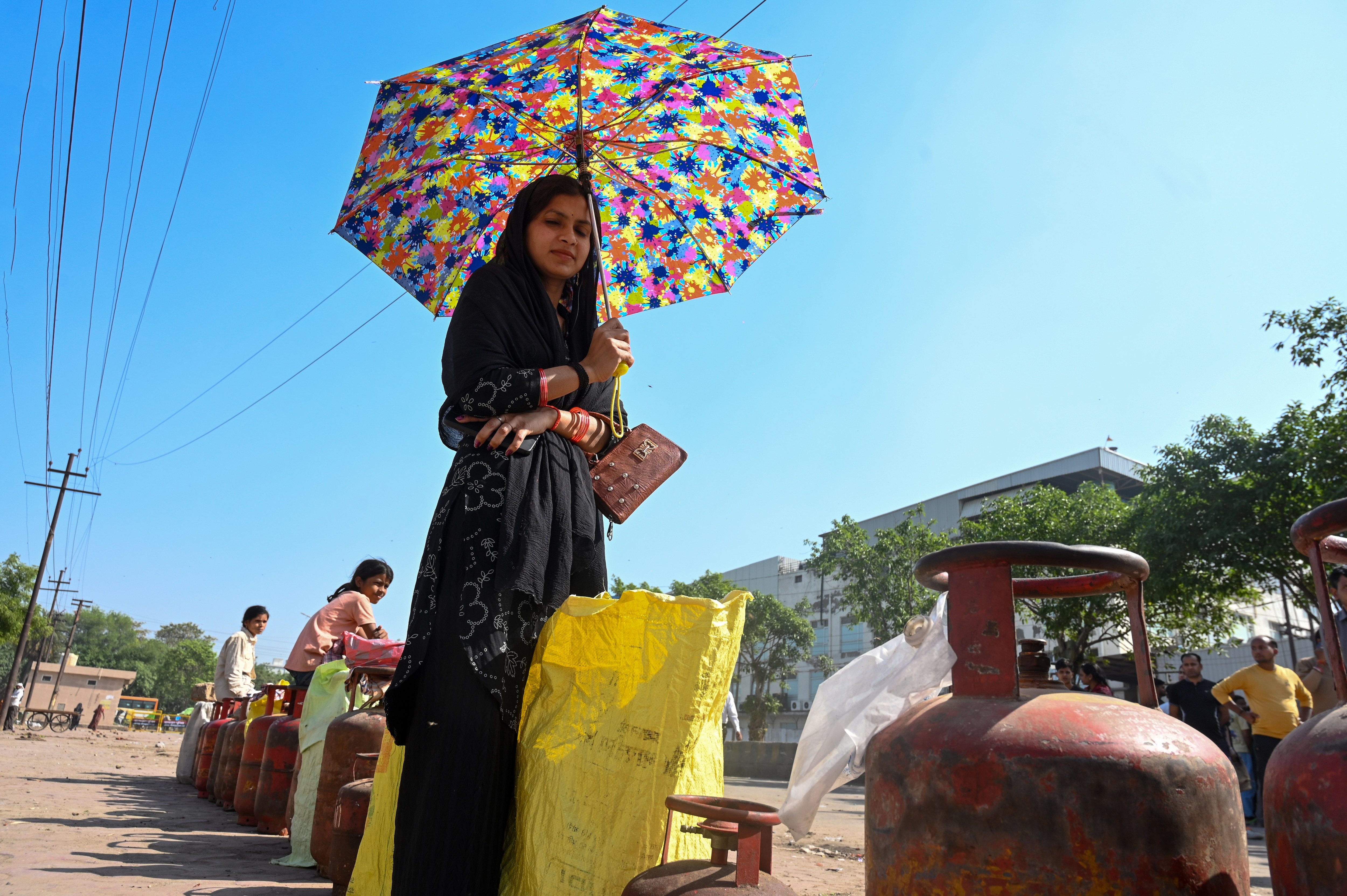 People wait to buy liquefied petroleum gas (LPG) cylinders at Nayagaon Sector 87. (Sunil Ghosh / Hindustan Times) People wait to buy liquefied petroleum gas (LPG) cylinders at Nayagaon Sector 87. (Sunil Ghosh / Hindustan Times)