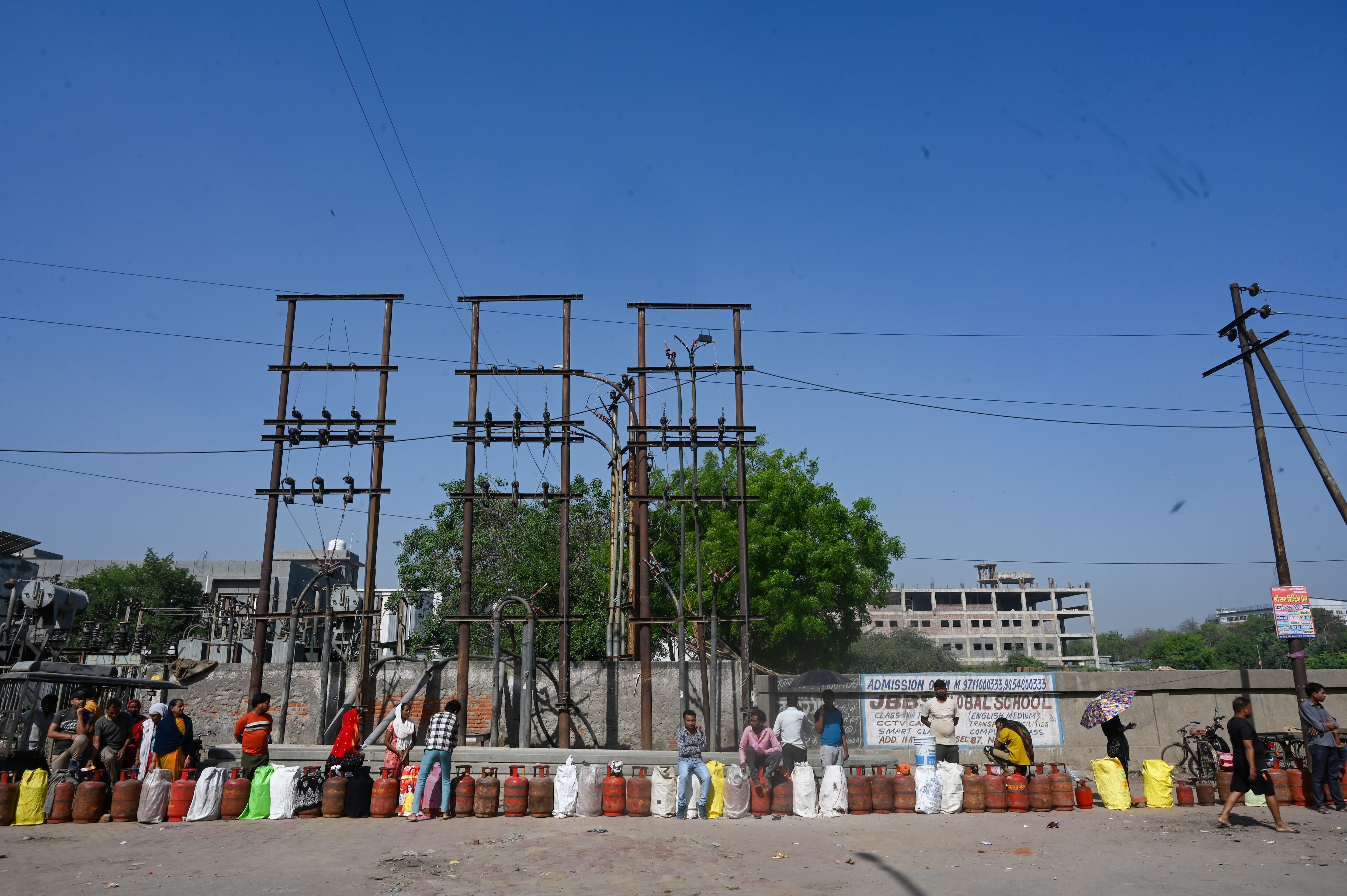 People wait to buy liquefied petroleum gas (LPG) cylinders at Nayagaon Sector 87. (Sunil Ghosh / Hindustan Times) People wait to buy liquefied petroleum gas (LPG) cylinders at Nayagaon Sector 87. (Sunil Ghosh / Hindustan Times)