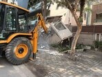 Highest violations found in DLF Phase 1; structures along key roads removed, including kiosks and illegal commercial extensions (HT )