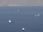 Ships and tankers in the Strait of Hormuz off the coast of Musandam, Oman.