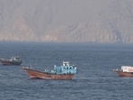 Ships and tankers in the Strait of Hormuz off the coast of Musandam, Oman.