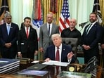 Donald Trump speaks before signing an executive order in the Oval Office of the White House in Washington, DC
