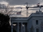 Cranes being used to construct the new White House ballroom are seen around the White House, April 4, in Washington.