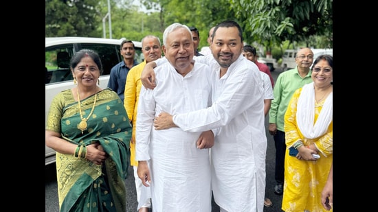 Bihar CM Nitish Kumar with his son Nishant Kumar. Now, both father and son will have heightened security cover. (Santosh Kumar/HT)