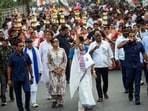 West Bengal Chief Minister and Trinamool Congress supremo Mamata Banerjee takes part in a roadshow from Sarat Sadan to Pilkhana in support of party candidates ahead of the West Bengal assembly elections. West Bengal Chief Minister and Trinamool Congress supremo Mamata Banerjee takes part in a roadshow from Sarat Sadan to Pilkhana in support of party candidates ahead of the West Bengal assembly elections.