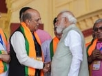 Prime Minister Narendra Modi with BJP leader Dinesh Trivedi, second left, during a rally at Brigade Parade Ground in Kolkata, Saturday, March 14, 2026. 