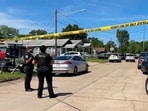 Police officers secure a street where eight children, with ages ranging from 1 to 14, were killed in a mass shooting in Shreveport, Louisiana on April 19.