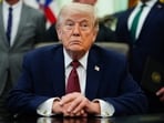 President Donald Trump listens in the Oval Office of the White House, Saturday, April 18, 2026, in Washington. 
