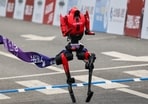 A Lightning humanoid robot by Honor crosses the finish line of the second Beijing E-Town Half Marathon and Humanoid Robot Half Marathon in Beijing