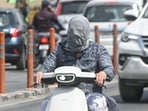 A commuter covers his face to combat the heat. (Mushtaq Ali/HT Photo) A commuter covers his face to combat the heat. (Mushtaq Ali/HT Photo)