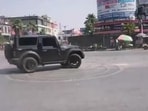 A still from the viral video shows the four-wheeler performing stunts at the busy Subhash Chowk crossing in Prayagraj on Sunday afternoon, forcing commuters to clear the area. (VIDEO GRAB)