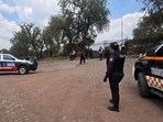 Police officers remain at the Teotihuacan archaeological zone following a shooting in Teotihuacan, State of Mexico, on April 20, 2026.