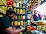 Prime Minister Narendra Modi buys jhalmuri, a street snack, in Jhargram on April 19.