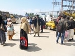 People stand at a bus stand amid a valley-wide “chakka jam” called by the All Jammu and Kashmir Transporters' Welfare Association to protest against the government's proposal to expand Smart City bus services in other districts, in Srinagar on Monday. (ANI) People stand at a bus stand amid a valley-wide “chakka jam” called by the All Jammu and Kashmir Transporters' Welfare Association to protest against the government's proposal to expand Smart City bus services in other districts, in Srinagar on Monday. (ANI)