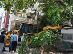 Teams demolish ramps, guard rooms and sheds; residents raise safety concerns and question selective targeting of private colonies (Parveen Kumar/HT Photo)