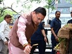 Uttarakhand CM Pushkar Singh Dhami inspects a complaint site in Dehradun following a CM Helpline 1905 grievance.