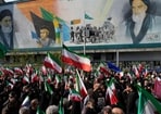 Mourners carry Iranian flags in Tehran on April 1, 2026 during a funeral procession for Alireza Tangsiri, head of Iran's Islamic Revolutionary Guard Corps Navy, and others killed in Israeli strikes 