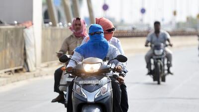 Patna, India - June 17, 2019:Commuters protected themselves from scorching sun light covered their bodies with cloths . More than 100 peoples died in different part of Bihar due to heat stork blistering heat wave conditions in the state in Patna, India, on Monday, June 17, 2019. (Photo by Parwaz Khan / Hindustan Times) (Parwaz Khan /HT PHOTO) Patna, India - June 17, 2019:Commuters protected themselves from scorching sun light covered their bodies with cloths . More than 100 peoples died in different part of Bihar due to heat stork blistering heat wave conditions in the state in Patna, India, on Monday, June 17, 2019. (Photo by Parwaz Khan / Hindustan Times) (Parwaz Khan /HT PHOTO)