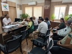 Addl municipal commissioner Omprakash Diwate (L) chaired a meeting on Tuesday and instructed officials to prepare a SOP for installing and managing overhead cables across the city. (HT PHOTO)