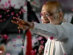 Assembly Elections 2026 highlights: India's Home Affairs Minister and Bharatiya Janata Party (BJP) leader Amit Shah waves as supporters shower him with rose petals during a road show ahead of the 2026 Tamil Nadu Legislative Assembly elections in Chennai on April 19, 2026. (Photo by R. Satish BABU / AFP)