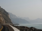 FILE PHOTO: A car rides along the coast of Musandam overlooking the Strait of Hormuz amid the U.S.-Israeli conflict with Iran, Oman, March 2, 2026.REUTERS/Amr Alfiky/File Photo