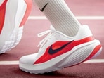 Nike running shoes on track showing light design, comfy cushioning and steady grip for everyday runs and fitness sessions comfortably.
