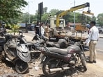 Officials said the drive has been launched in response to a growing number of complaints from citizens about vehicles left unattended for weeks and even months on busy roads, internal lanes and near commercial hubs. (MAHENDRA KOLHE/HT PHOTO)