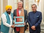 Punjab chief minister Bhagwant Mann and state industries minister Sanjeev Arora with Dutch hockey icon Floris Jan Bovelander in Amsterdam on Tuesday. (X)