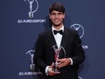 Carlos Alcaraz poses with his Laureus World Sportsman of the Year award during the 2026 Laureus World Sports Awards ceremony. 