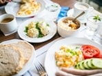 Starting the day with a heavy breakfast and progressively eating lighter meals helps in the weight loss journey, shares Dr Rajan. 