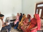 An official briefing a group of rural women about their responsibilities in Prayagraj. (HT PHOTO)