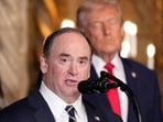 Former Secretary of the Navy John Phelan speaks, as President Donald Trump listens, at Trump's Mar-a-Lago club