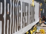 TUCSON, ARIZONA - MARCH 03: Catalina Ochoa visits a memorial for Nancy Guthrie in front of the KVOA news station on March 03, 2026 in Tucson, Arizona. (Photo by JUSTIN SULLIVAN / GETTY IMAGES NORTH AMERICA / Getty Images via AFP)