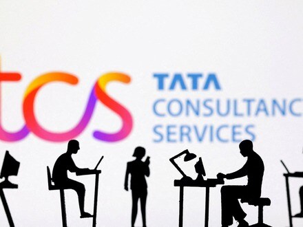 FILE PHOTO: Figurines with computers and smartphones are seen in front of TCS: Tata Consultancy Services logo in this illustration taken, February 19, 2024. REUTERS/Dado Ruvic/Illustration/File Photo