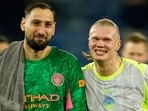 Manchester City's goalkeeper Gianluigi Donnarumma (left) and Erling Haaland walk off the pitch after Wednesday's 1-0 win against Burnley. 