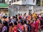 Voters queue up to cast their votes outside a polling station during the West Bengal Legislative Assembly elections in Berhampore, Murshidabad district. 