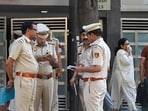 Delhi Police officials and forensic team members are seen at a residence in Kailash Hills, Amar Colony area, in New Delhi. 